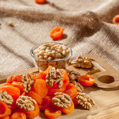 Nuts and dried apricots are rich in vitamins useful for humans.
