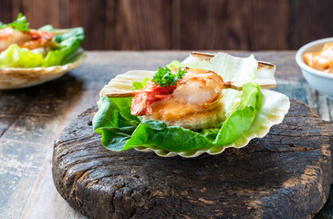 Canapes with grilled black tiger prawns and seafood sauce