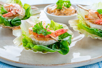 Canapes with grilled black tiger prawns and seafood sauce