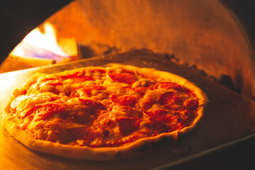 Salami Pizza Into the oven have fire burn near cooked