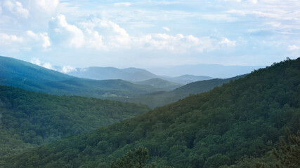 The ridge tops of the Blue Ridge mountains appear to go forever beyond the horizon.