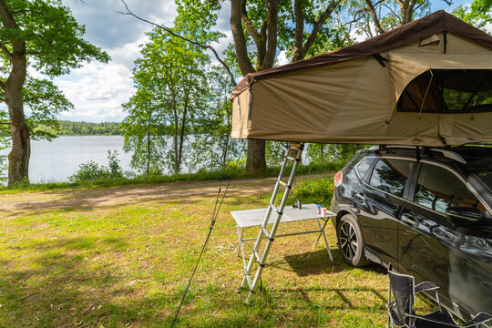 Suv With A Roof Top Tent Out In The Wild