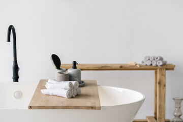 Modern bathroom interior with bathtub and water tap