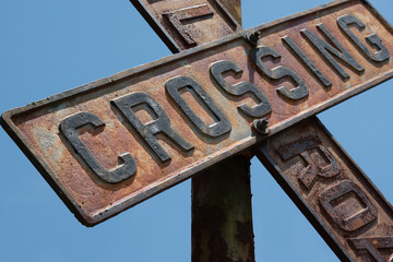 vintage sign post railroad crossing