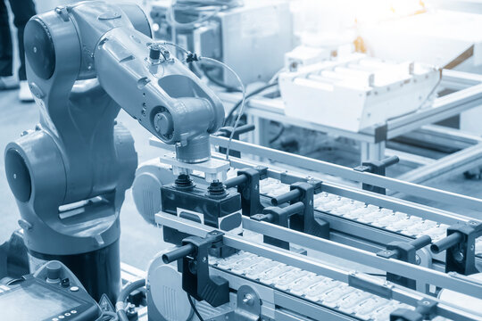 The material handling process by automatic robotic system. The hi-autonomous technology  production line by robotic arms.