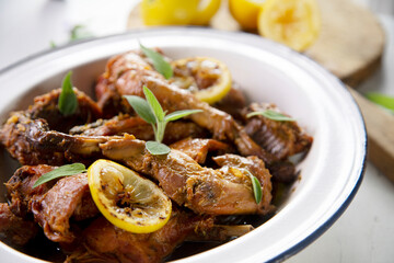 Wild rabbit cooked with lemon and salvia