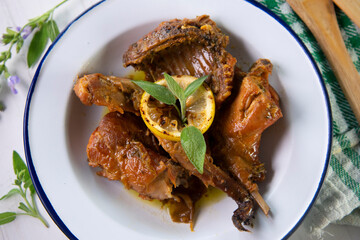 Wild rabbit cooked with lemon and salvia