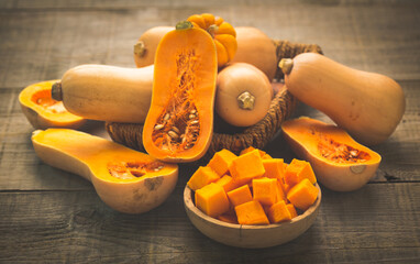 Fresh butternut squash on the wooden table - Powered by Adobe