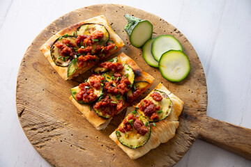Coca from mallorca with sobrassada and zucchini