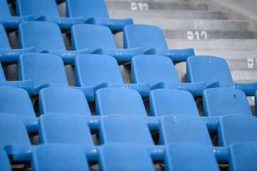 Fototapeta premium Empty soccer stadium tribune. As a safety measure during corona virus pandemic, soccer matches are taking place without public