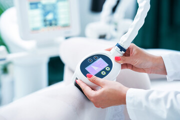 Adult woman in beauty salon undergoing anti cellulite and slimming treatment