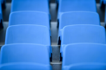 Fototapeta premium Empty soccer stadium tribune. As a safety measure during corona virus pandemic, soccer matches are taking place without public
