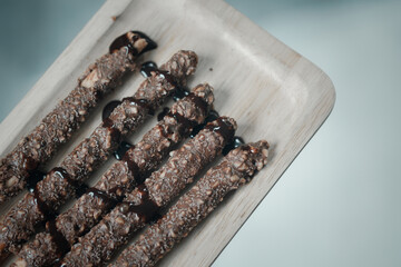 Crispy sweet straw covered chocolate with almond crush
