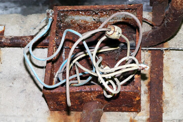 old rusty electrical panel. Rotten wire