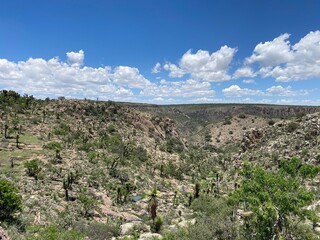 canyon mountain landscape with blue sky and clouds