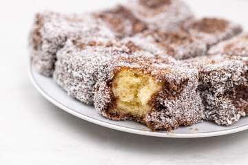 Square Chocolate cookies with coconut served on the plate