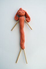 creation of a doll with plasticine made by a 5 year old girl