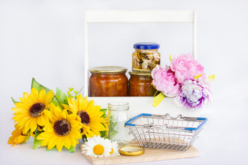 Glass jars with jam and pickles.