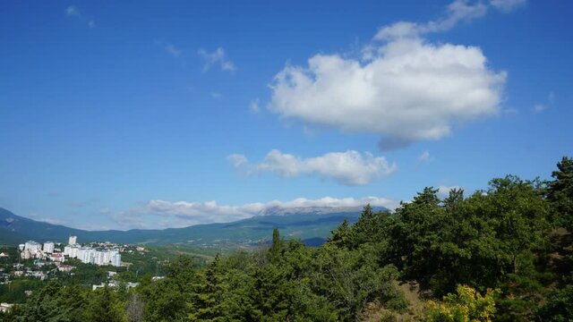 flying white clouds over the mountain chat dag