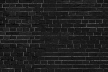 Black brick wall. Loft interior design. Black paint of the facade.