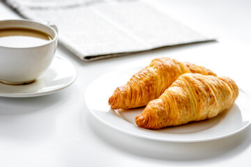 Business lunch with croissant on white table top view