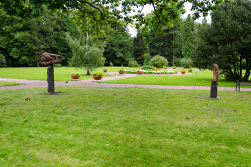 Green garden with grass. Summer courtyard with lawn. Beautiful summer landscape landscape park. Nature for background on postcard.