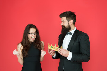 Promotion and reward. Prom queen. Bearded man sexy girl. Royal party. Prom couple in formal style. Prom party. Holiday celebration. Pride and glory. Luxury reward. Success symbol. Party night