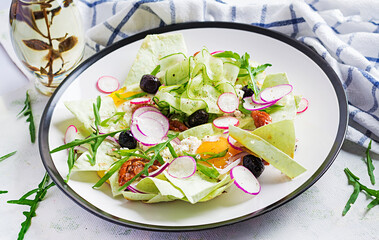 Chilaquiles (in Mexican cooking) a dish of fried tortilla strips  with a eggs and cheese. Mexican food. Mexican breakfast.