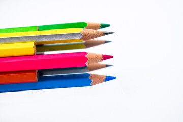 Many different colored wood pencil crayons placed together in a circle