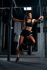 Fototapeta na wymiar Fitnesswoman posing in gym.