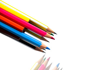 Fototapeta premium Two stack of different colored wood pencil crayon placed on a white background