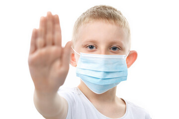 Child in medical mask put a palm in the stop sign.