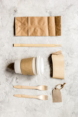 paper bags and plastic cup for take away set top view space for text