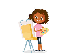 Girl painting, draws a picture with oil paints standing with a palette in front of an easel.