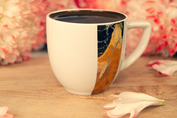 morning coffee in a white mug, flowers