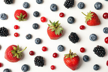 Obraz na płótnie Canvas Flat lay with fresh berries on white background, top view