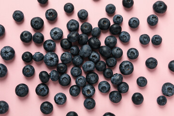 Delicious fresh blueberry on pink background, top view