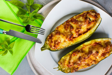 Zucchini stuffed with fresh tomatoes, tomato sauce, gouda cheese and mozzarella cheese.