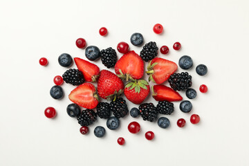 Mix of fresh berries on white background, top view