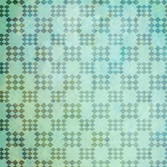 Green geometric pattern background with a grunge flair of diamond shapes.  12x12 design element.