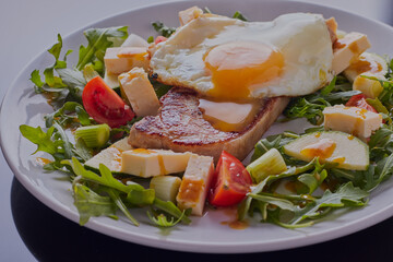 Pork loin steak with egg and mixed salad.