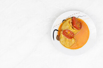 Stuffed paprika with minced meat and served on the plate
