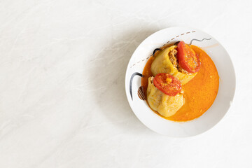 Stuffed paprika with minced meat and served on the plate