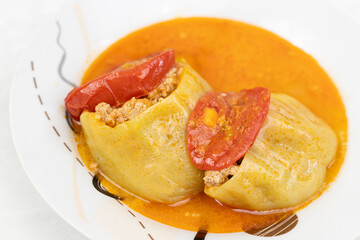 Stuffed paprika with minced meat and served on the plate