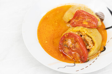 Stuffed paprika with minced meat and served on the plate