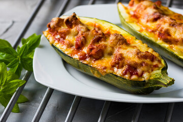 Zucchini stuffed with fresh tomatoes, tomato sauce, gouda cheese and mozzarella cheese.