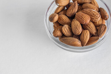 bowl of almonds white background 