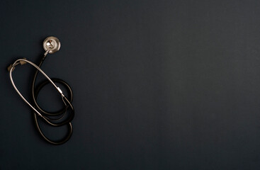 Covid-19 Coronavirus concept. stethoscope medicine accessories, black background with copy space....