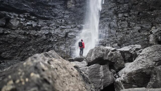 Hiker On Rocks Below Fossa Waterfall
