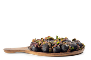 Mangosteen on a wooden tray isolated on white background